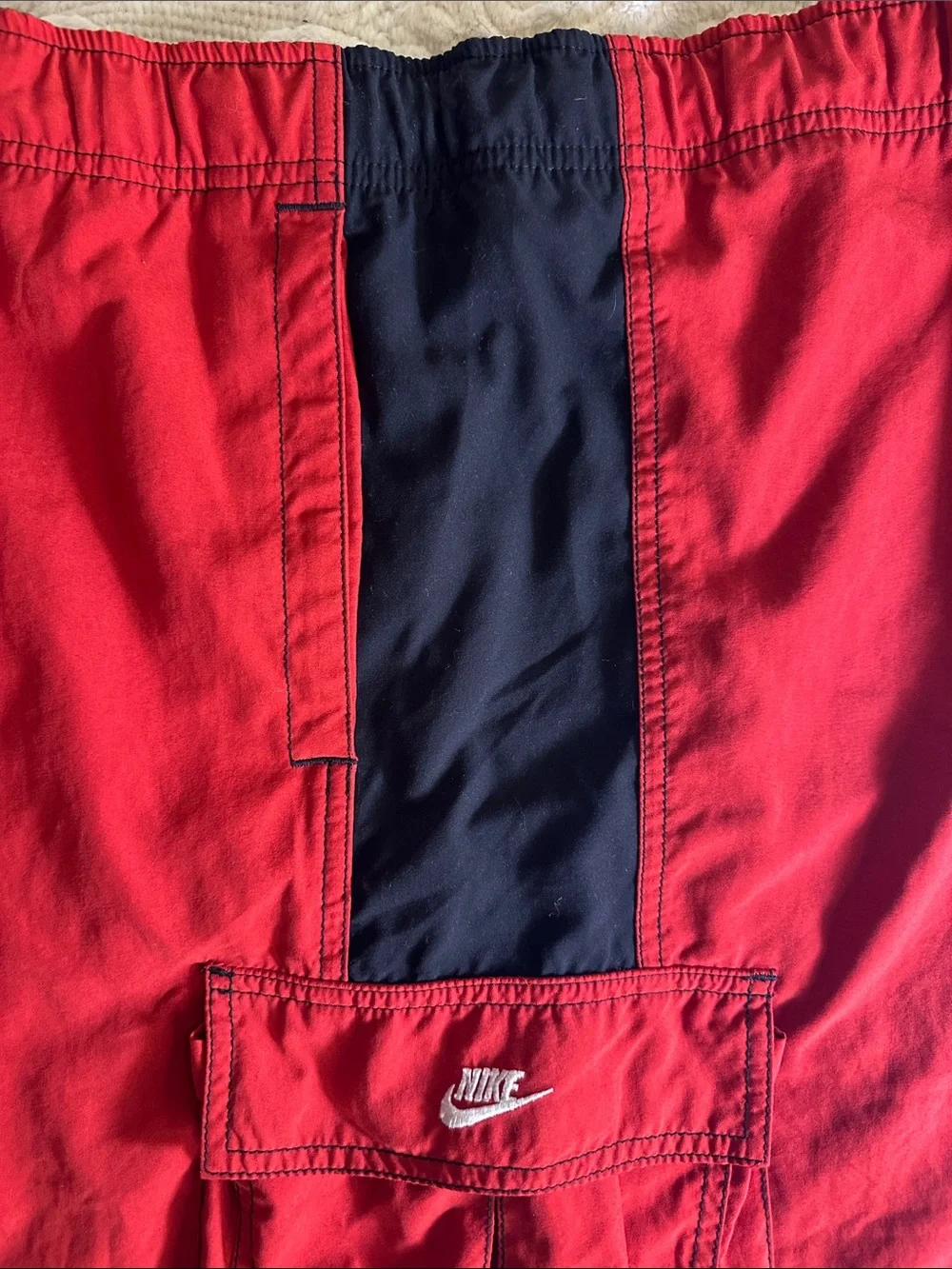 Nike Red Swim Shorts with Black trim and pockets